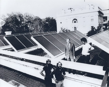 Black and white photo of solar panels mounted on rooftop