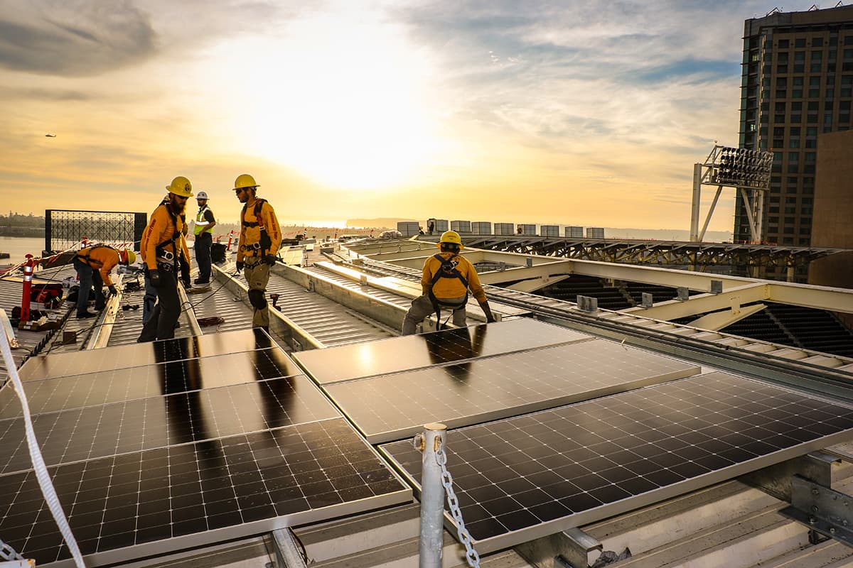 Sunshining on Sullivan Solar Power electricians installing panels atop Petco Park