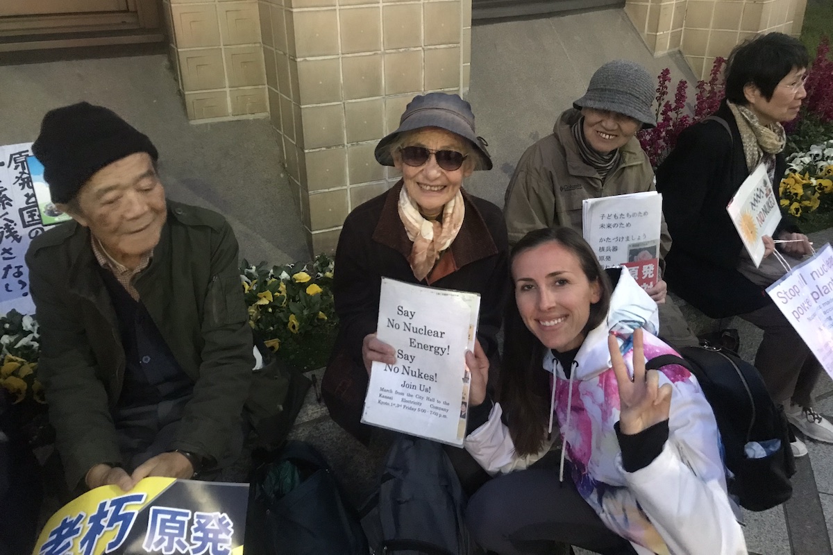 Image of Sullivan Solar Power Director of Community Development at a nuclear protest in Kyoto Japan