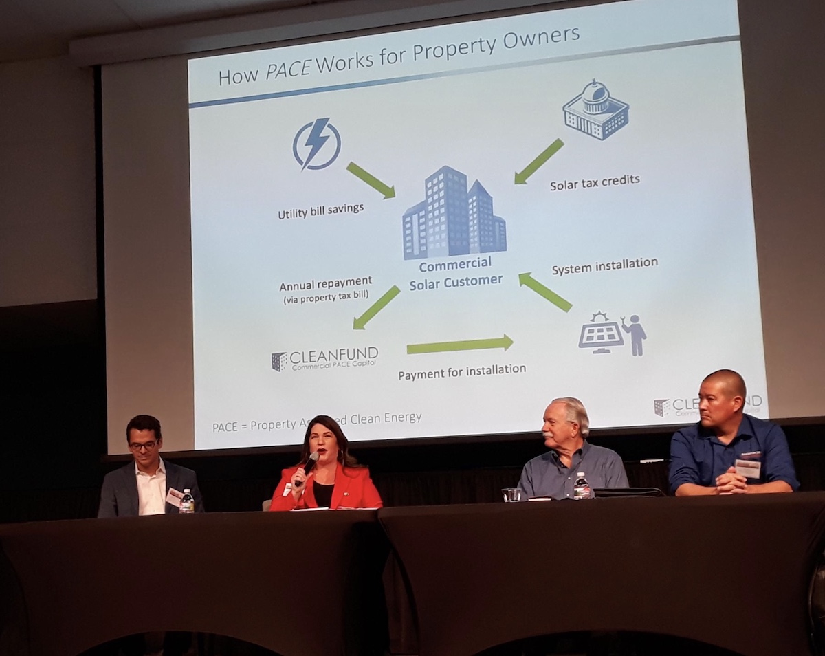 Picture of Riverside solar power community developer, Emily Padilla speaking at UC Riverside Solar Power Conferene.